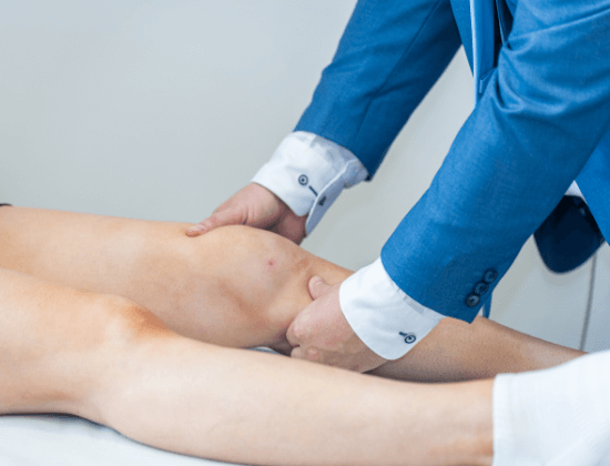 Person's knee being assessed.